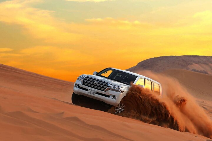 Experience the majesty of the Dubai desert as your Jeep glides over golden dunes revealing stunning landscapes and the unique flora and fauna that thrive in this magical morning light.